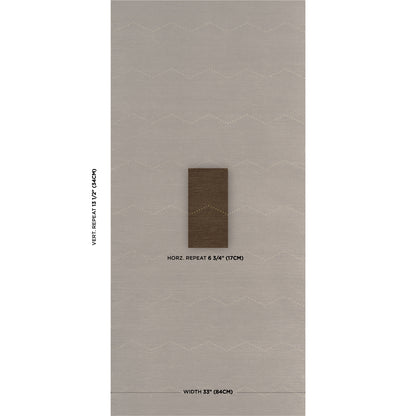 Beige rug with soft white chevron pattern and a small brown rectangular swatch in the center.