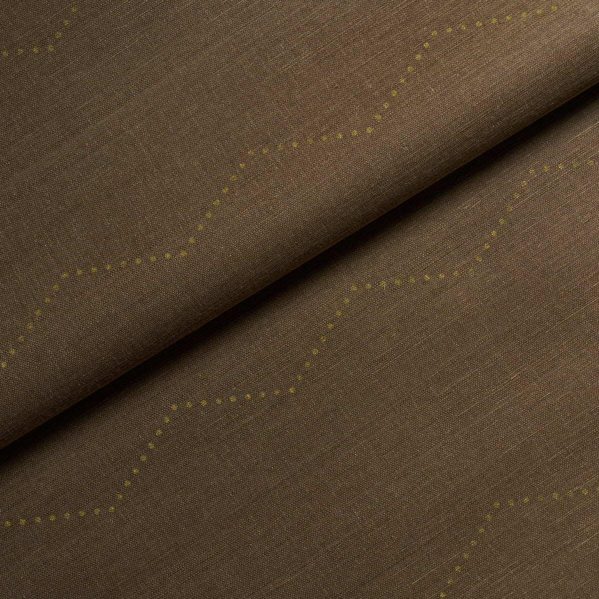 Brown linen-like fabric with pale yellow dotted zigzag pattern, folded; versatile upholstery or drapery textile.