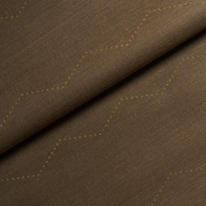 Brown linen-like fabric with pale yellow dotted zigzag pattern, folded; versatile upholstery or drapery textile.