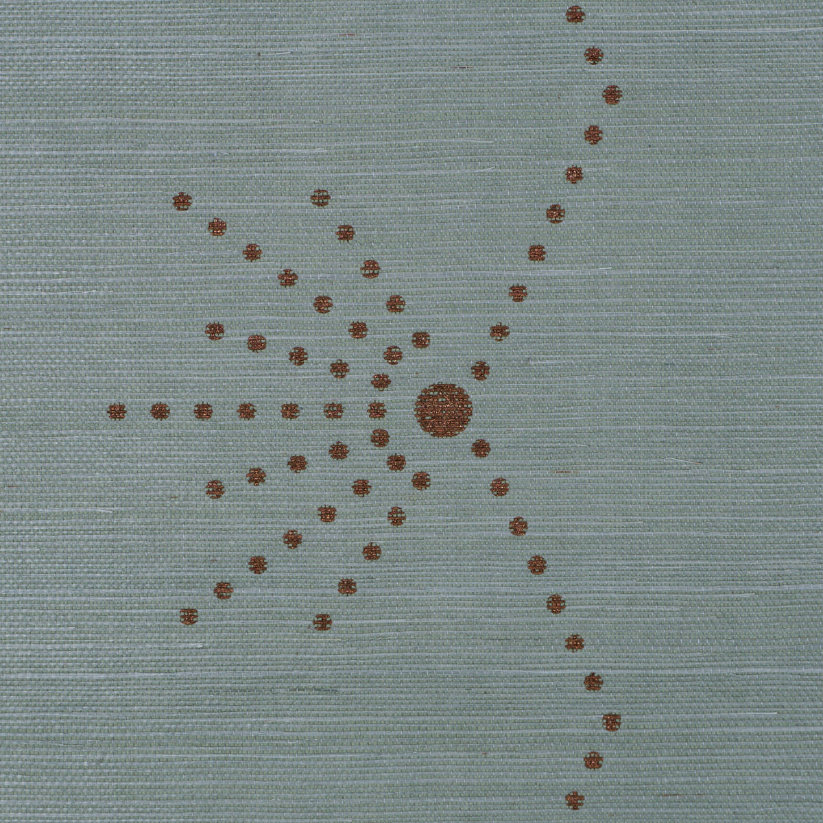 Blue-gray woven fabric with copper-brown dotted sunburst motif, central dot and radiating dotted lines.