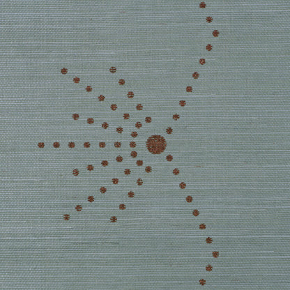 Blue-gray woven fabric with copper-brown dotted sunburst motif, central dot and radiating dotted lines.