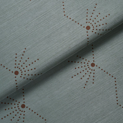 Teal fabric with brown dotted starburst motifs & a fine diagonal weave texture; decorative upholstery material.