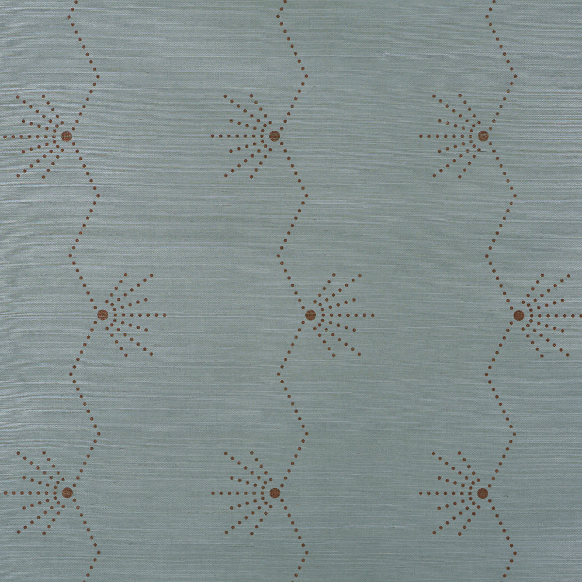 Muted blue-gray wallpaper with brown dotted sunburst motifs linked by zigzag lines.