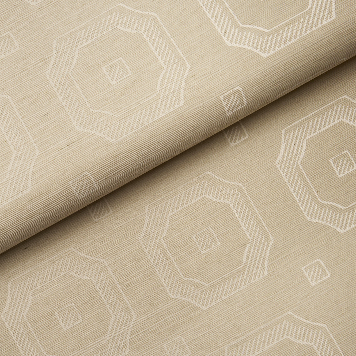 Beige fabric with white geometric octagon pattern; folded, woven texture for upholstery or drapes.