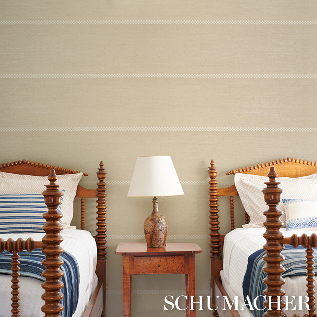 Beige wall covered with a textured woven wallcovering in a checker striped sisal birch pattern.