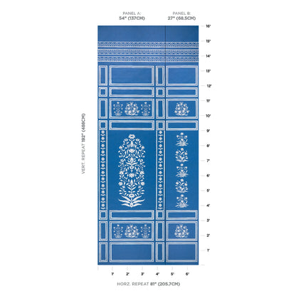 Blue wallpaper with white floral damask motifs in framed panels and ornamental borders; decorative wall covering.