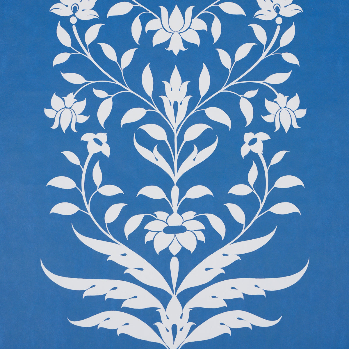 White ornate floral damask pattern on blue background; symmetrical botanical motif, decorative wallpaper & fabric print.