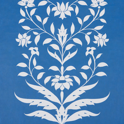 White ornate floral damask pattern on blue background; symmetrical botanical motif, decorative wallpaper & fabric print.