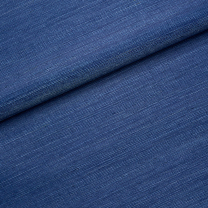 Blue backdrop fabric close-up with a folded edge.