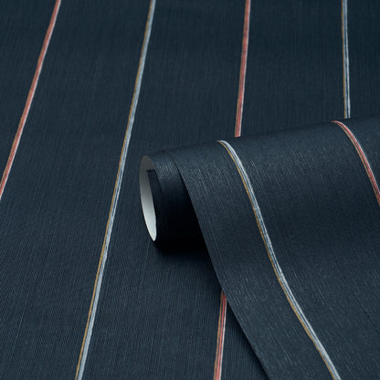 Dark navy fabric with thin orange, blue and beige stripes; woven texture, rolled edge.