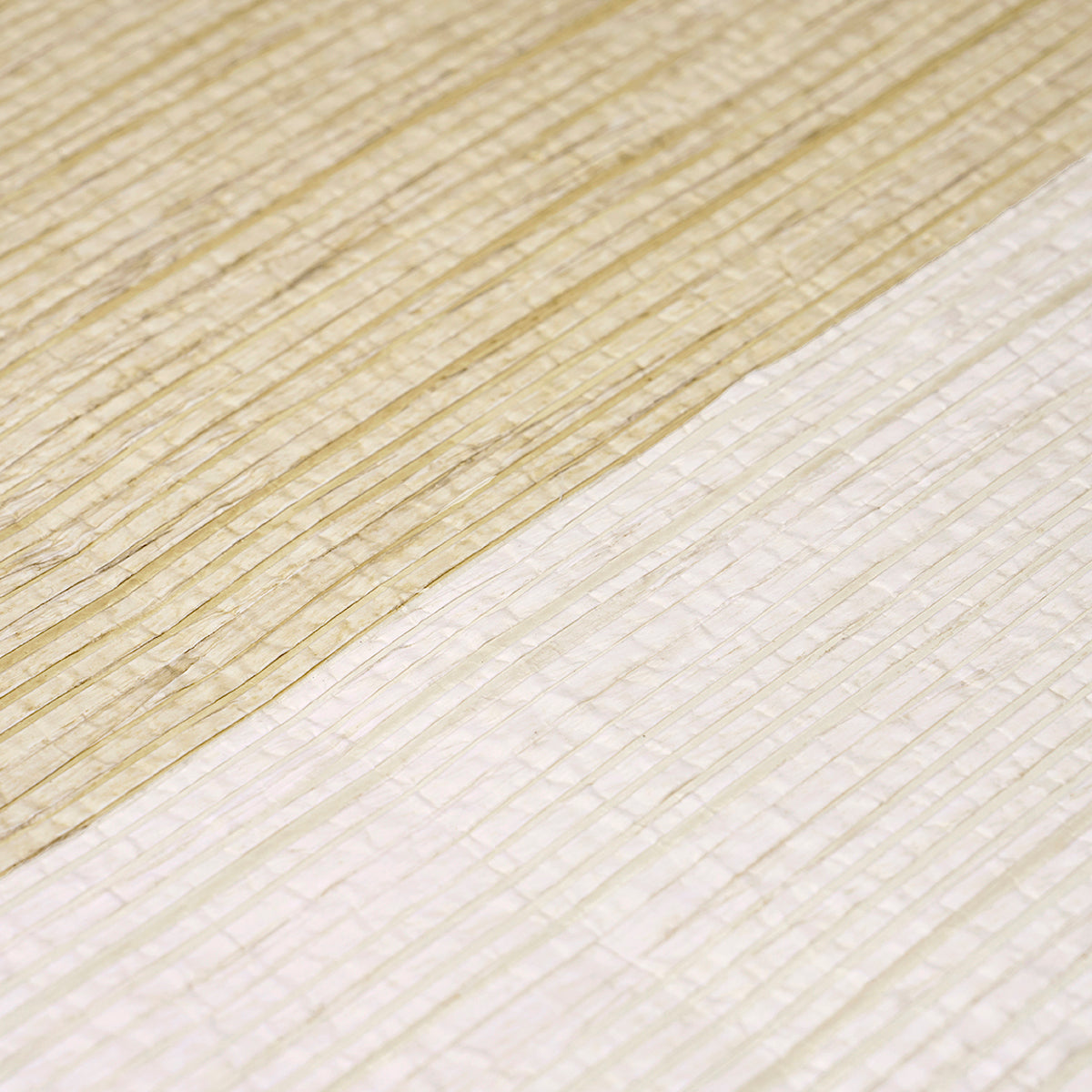 Close-up of two-tone light wood plank with prominent diagonal grain pattern and smooth texture.