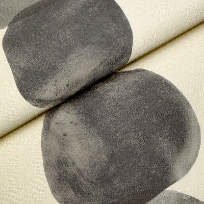 Beige fabric with bold charcoal gray circular shapes; abstract geometric print for upholstery, cushions or drapery.