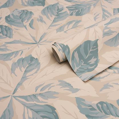 Beige fabric with blue-green leafy pattern, rolled corner reveals soft textile surface.