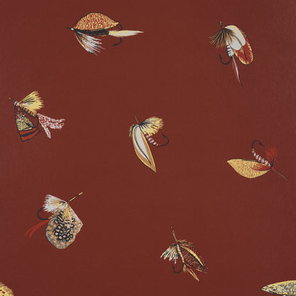 Rust-colored textile pattern featuring scattered vintage fishing flies in gold, cream and brown.