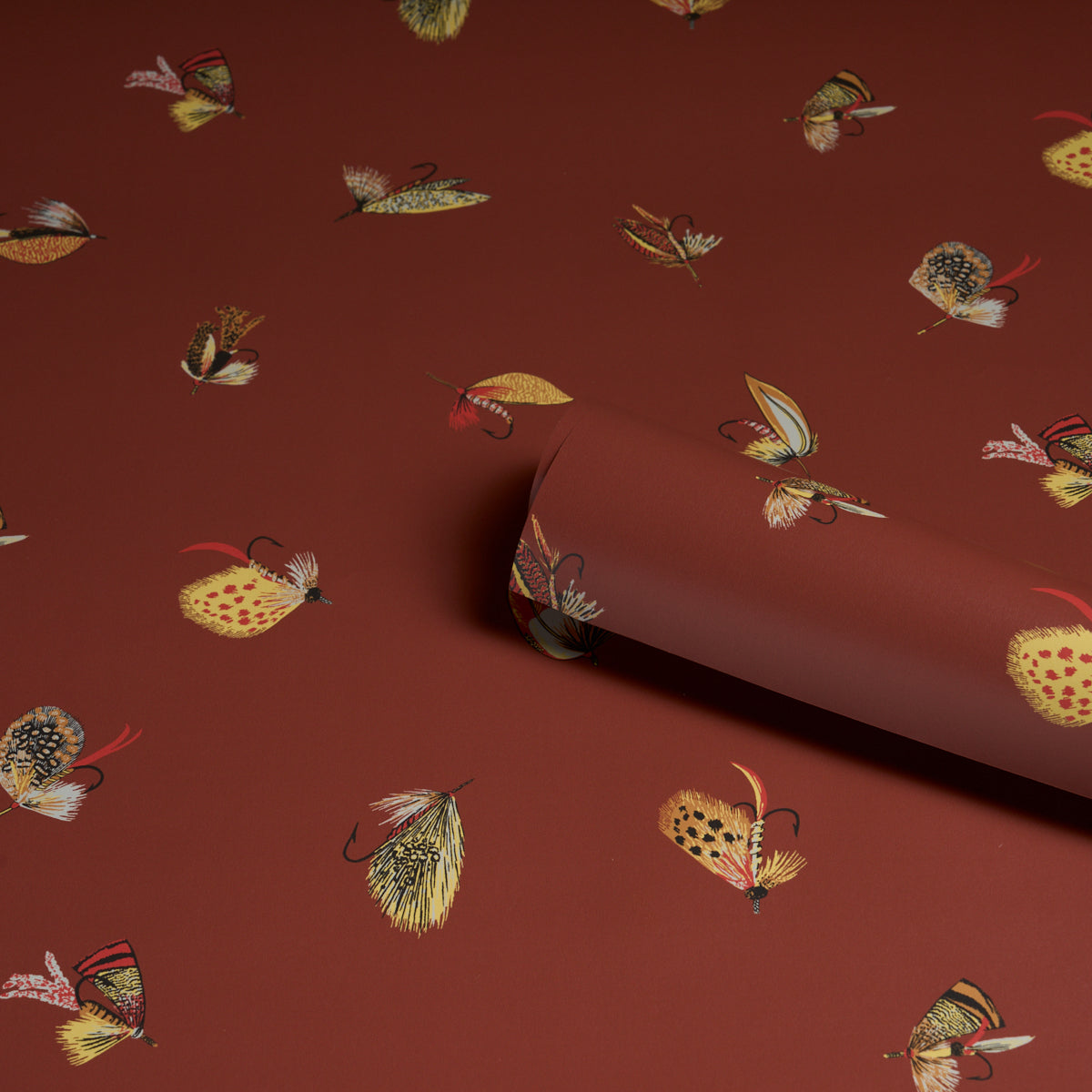 Russet background with a fly fishing motif; pattern features fishing gear and related imagery.