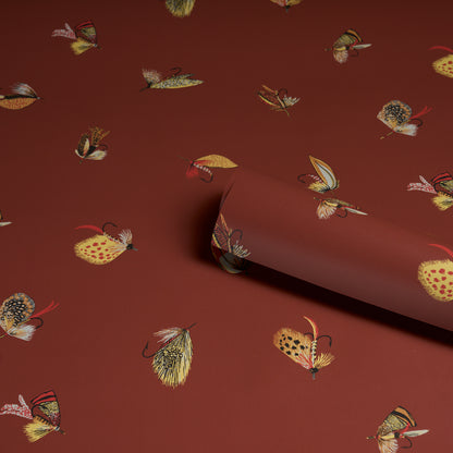 Russet background with a fly fishing motif; pattern features fishing gear and related imagery.