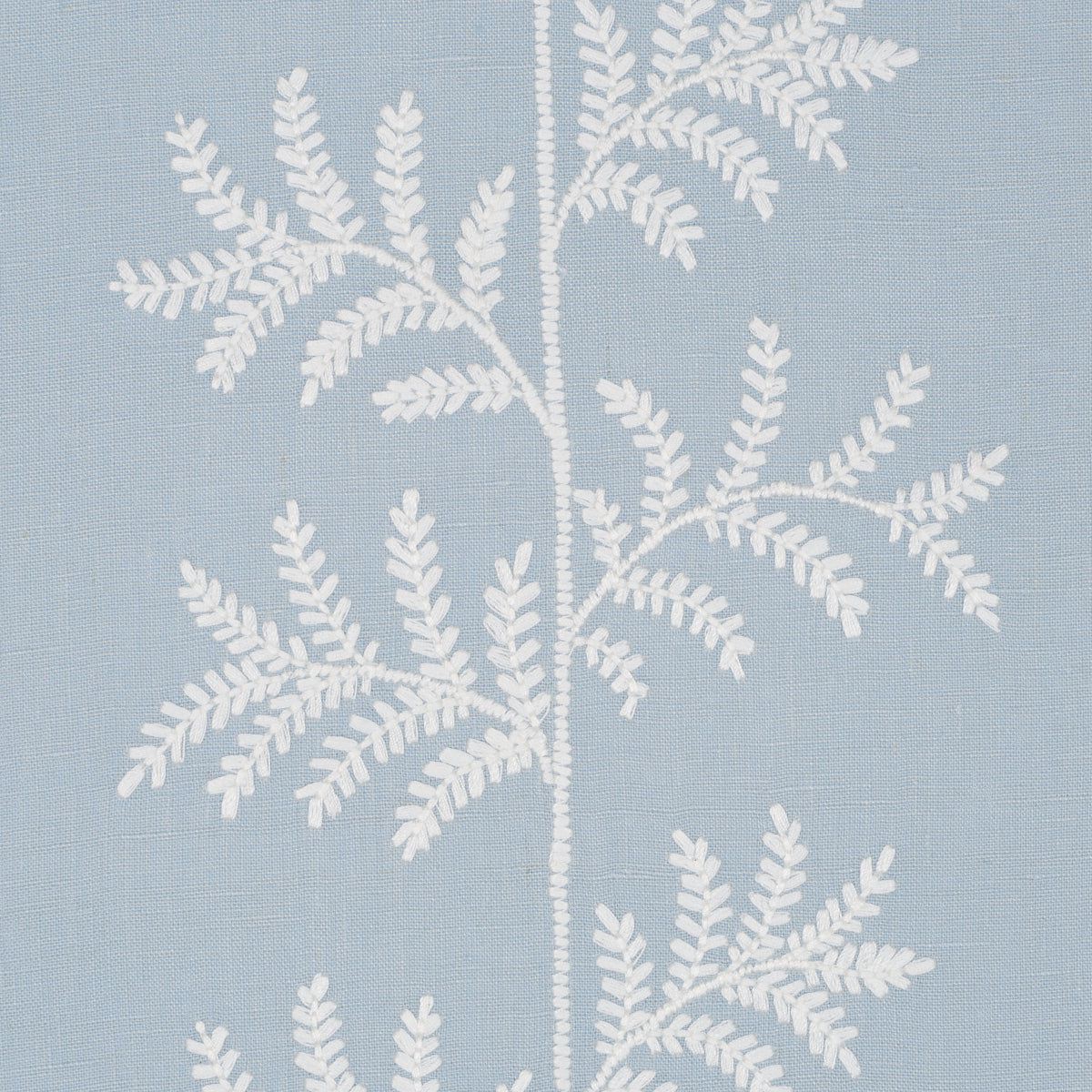 Light blue fabric with white embroidered fern leaves; decorative textile for pillows or curtains.