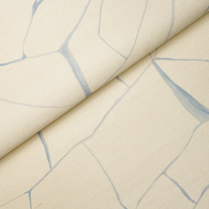Beige fabric with pale blue crackle lines, rolled fold; subtle marble-like pattern for upholstery or drapery.