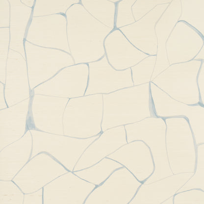 Cream mosaic of irregular stone tiles with pale blue grout lines.