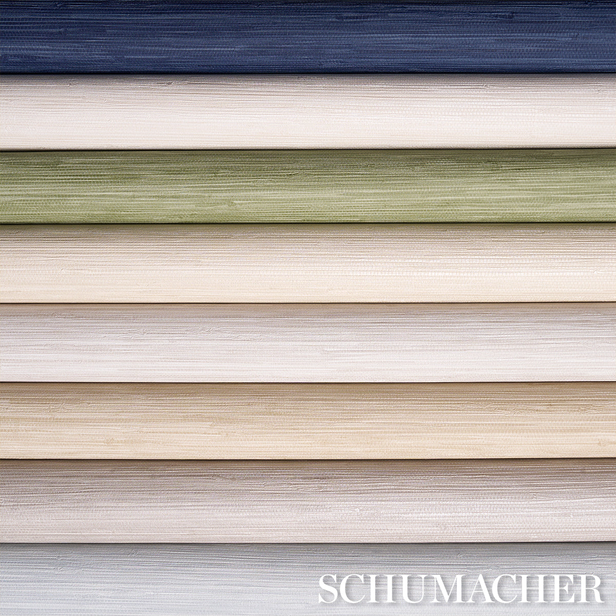 Stacked wallpaper swatches with linen texture in navy, ivory, sage green, beige, taupe, pale blue; Schumacher.