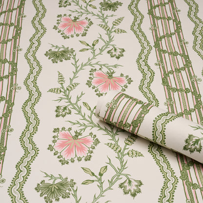 Cream floral wallpaper with pink flowers, green vines, and decorative green striped borders; rolled corner reveals pattern.