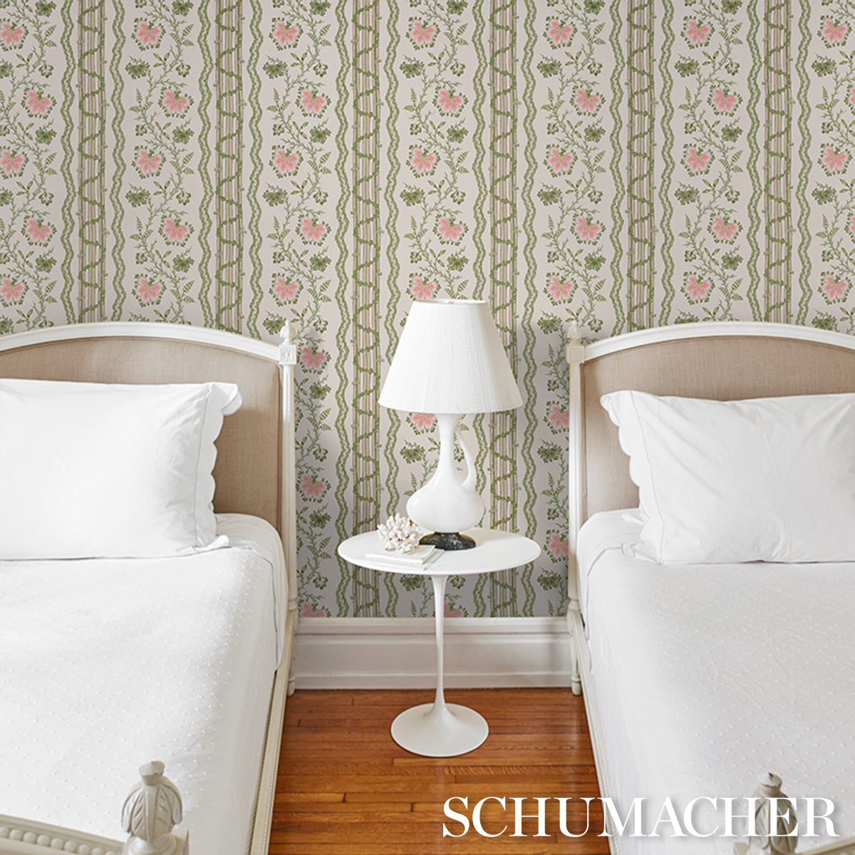 Floral green and pink striped wallpaper visible on the wall.