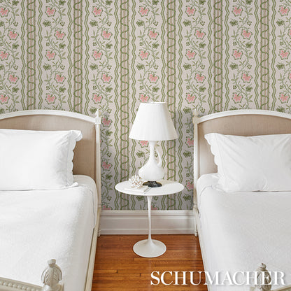 Floral green and pink striped wallpaper visible on the wall.