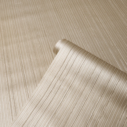 Champagne ribbed vinyl wallpaper roll with subtle vertical stripes, partially unrolled on a neutral backdrop.
