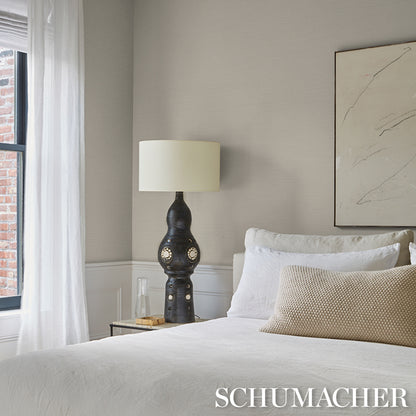 Parchment-colored vinyl wallpaper with a fine weave texture.