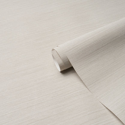 Pale dove gray vinyl wallpaper roll with abaca fine-weave texture, partially unrolled.