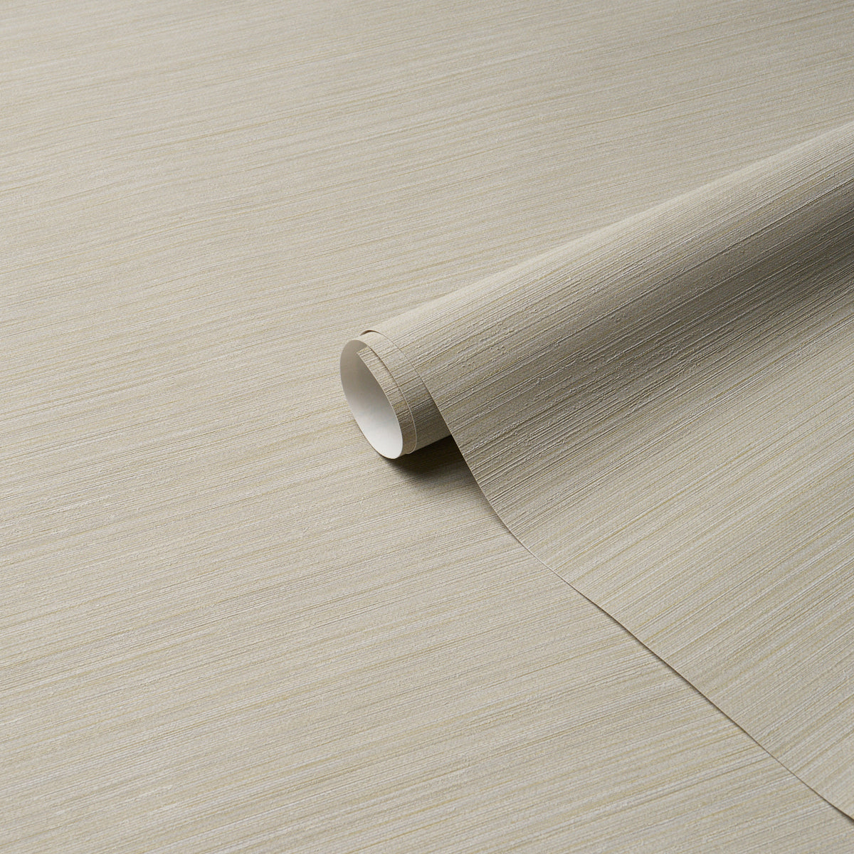 Beige textured wallpaper roll with linen-like grain, partially unrolled for wall decor.