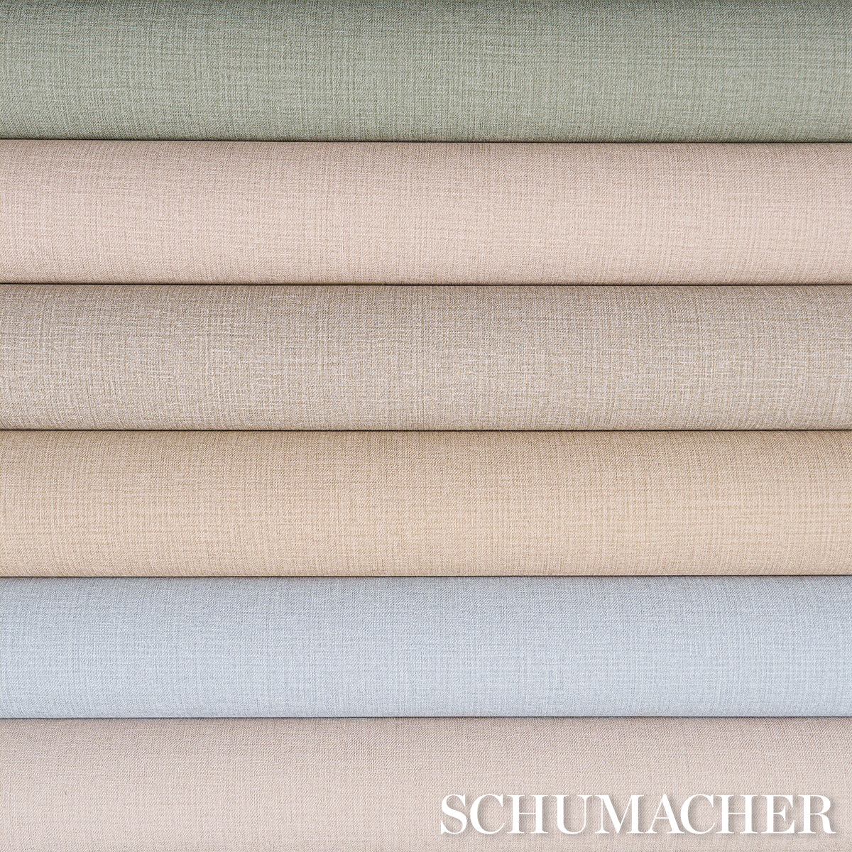 Stacked linen-look vinyl rolls in pastel greens, beiges and blue-gray; textured, ideal for upholstery or drapes.