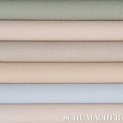 Stacked linen-look vinyl rolls in pastel greens, beiges and blue-gray; textured, ideal for upholstery or drapes.