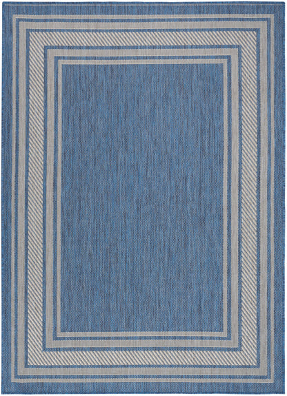 Blue woven rug with concentric cream and light blue borders; geometric rectangular design for indoor living spaces.