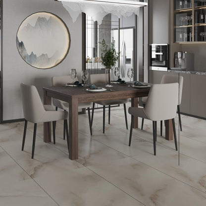 Dark wood dining table with beige upholstered chairs in a modern kitchen; round wall art, marble floor, elegant setting.