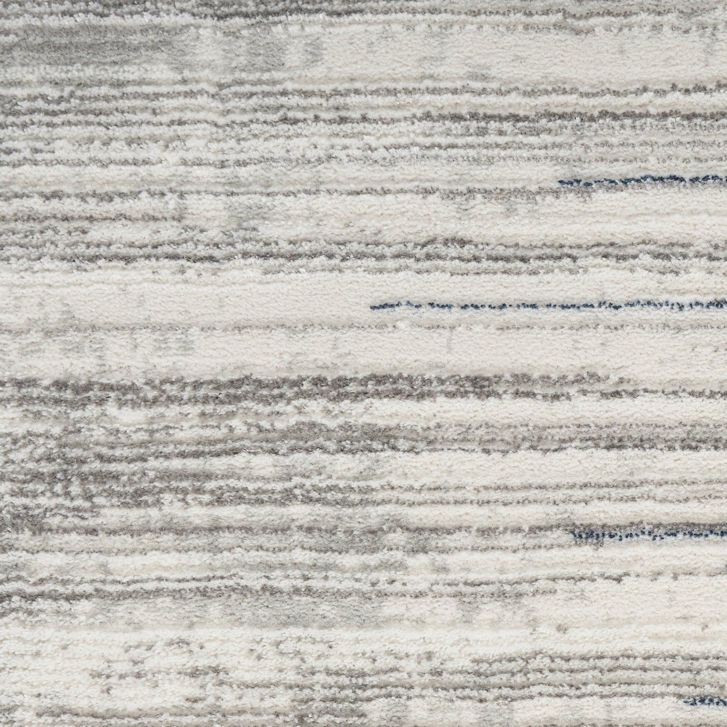 Light gray & ivory striped area rug with textured, brushed pile; modern, contemporary home decor.