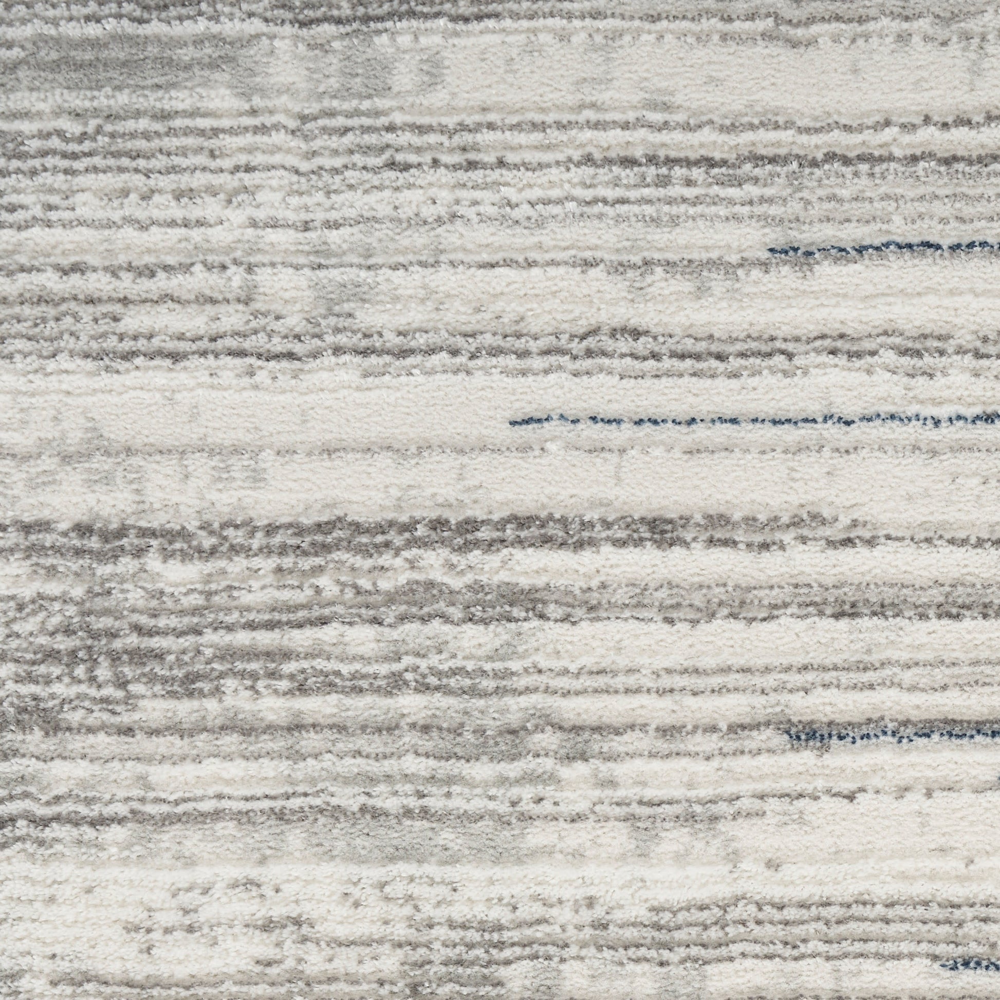 Light gray & ivory striped area rug with textured, brushed pile; modern, contemporary home decor.