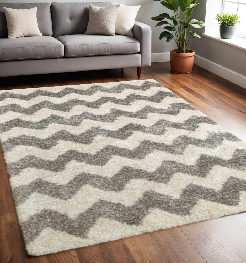 5' X 8' Grey And Ivory Geometric Shag Power Loom Stain Resistant Area Rug