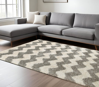 6' X 9' Grey And Ivory Geometric Shag Power Loom Stain Resistant Area Rug