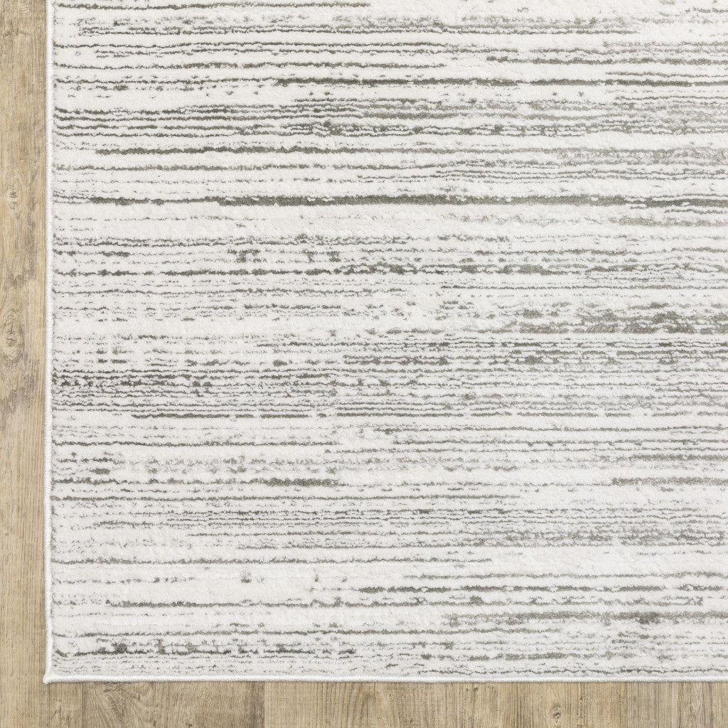 2' X 8' White And Grey Abstract Power Loom Stain Resistant Runner Rug