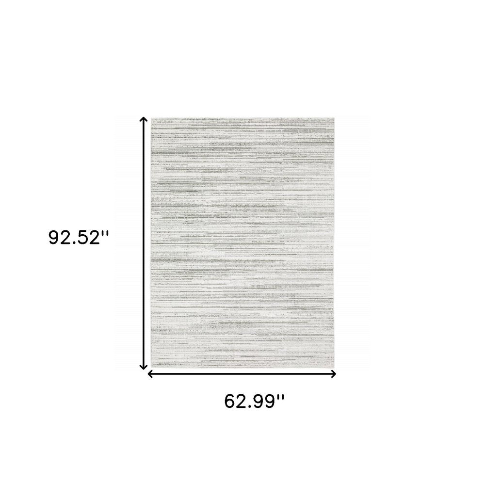 5' X 8' white and grey abstract power loom area rug, stain resistant.