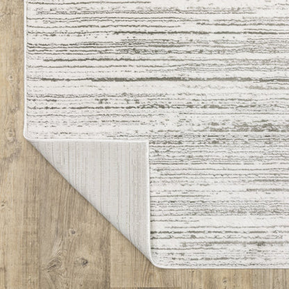5' x 8' white and grey abstract power loom stain resistant area rug