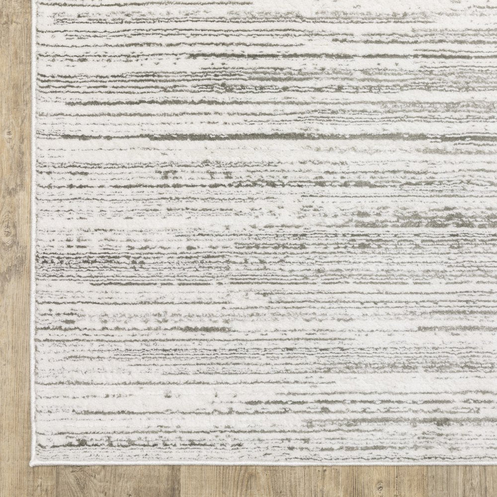 5' X 8' white and grey abstract power-loomed area rug, stain resistant.