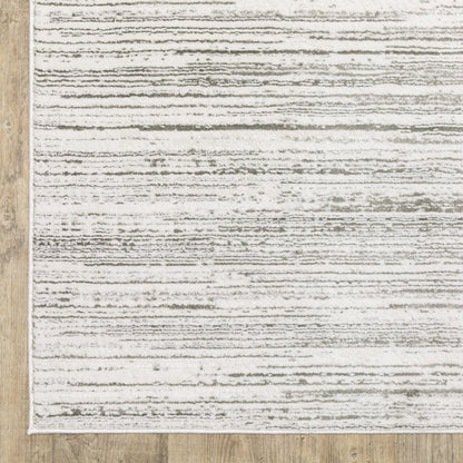 5' X 8' white and grey abstract power-loomed area rug, stain resistant.