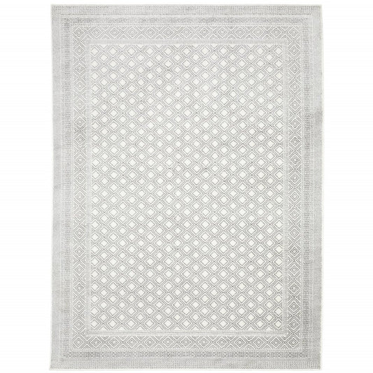 7' X 10' white and gray oriental distressed area rug