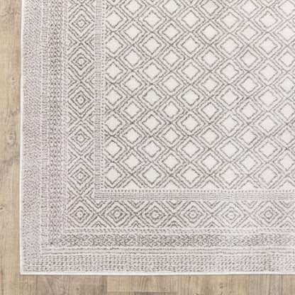 10' x 13' white and grey oriental area rug with power loom construction and stain resistant.