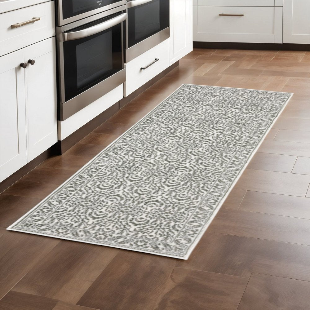 2' X 8' Grey And White Floral Power Loom Stain Resistant Runner Rug