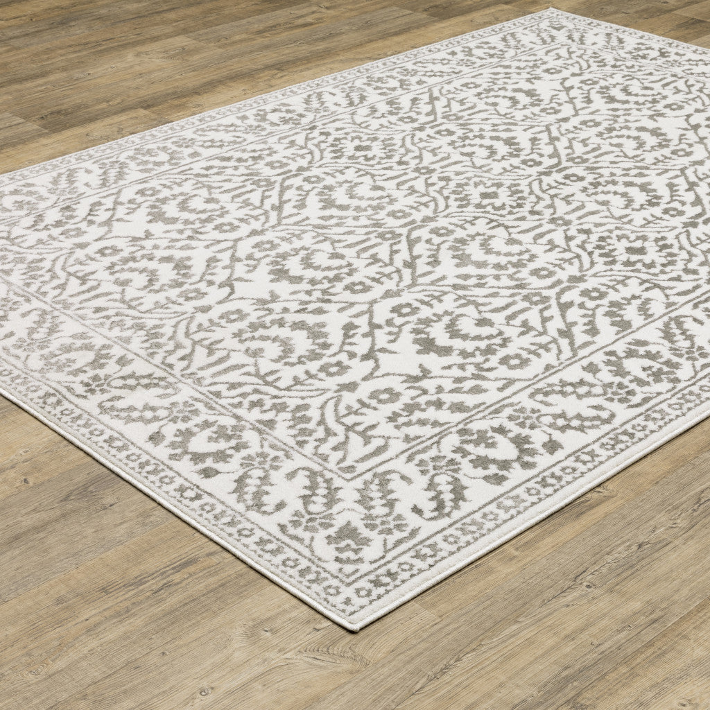 3' X 5' Grey And White Floral Power Loom Stain Resistant Area Rug