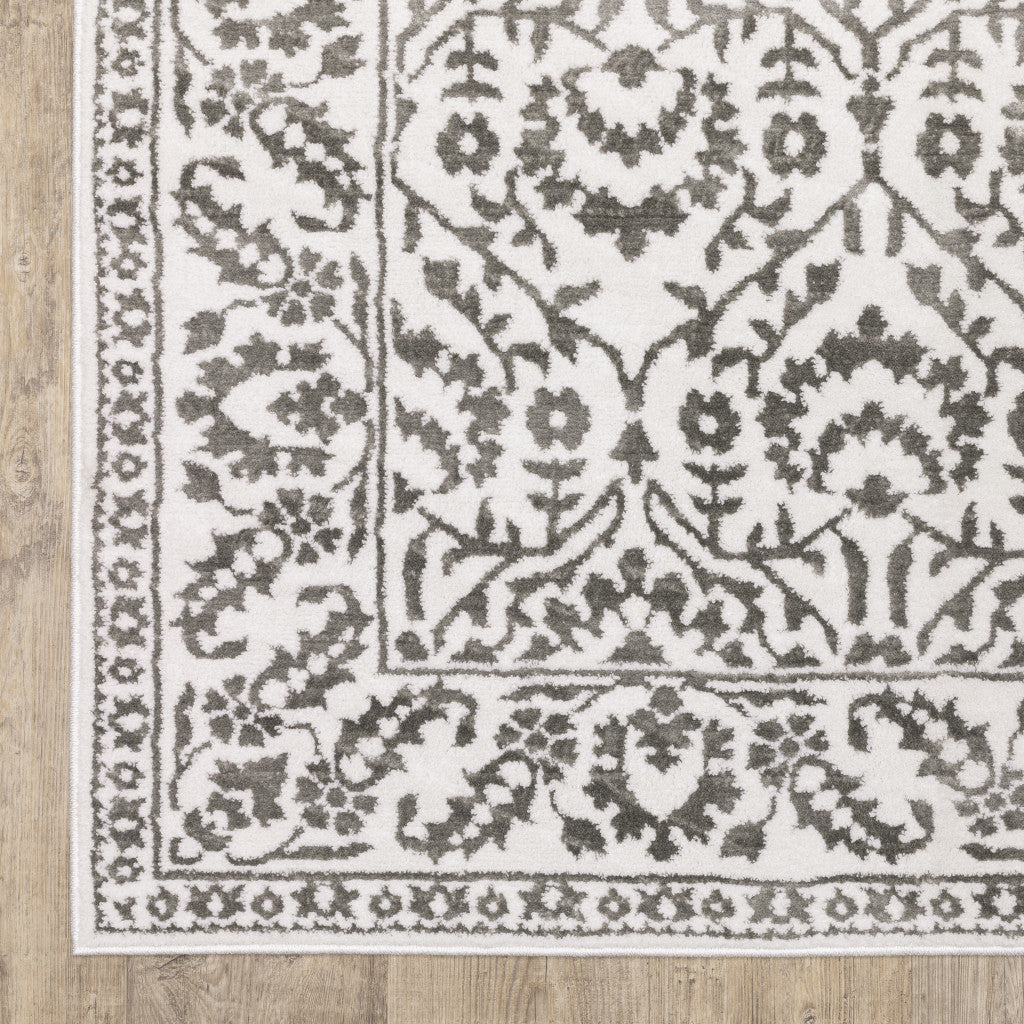 5' X 8' Grey And White Floral Power Loom Stain Resistant Area Rug