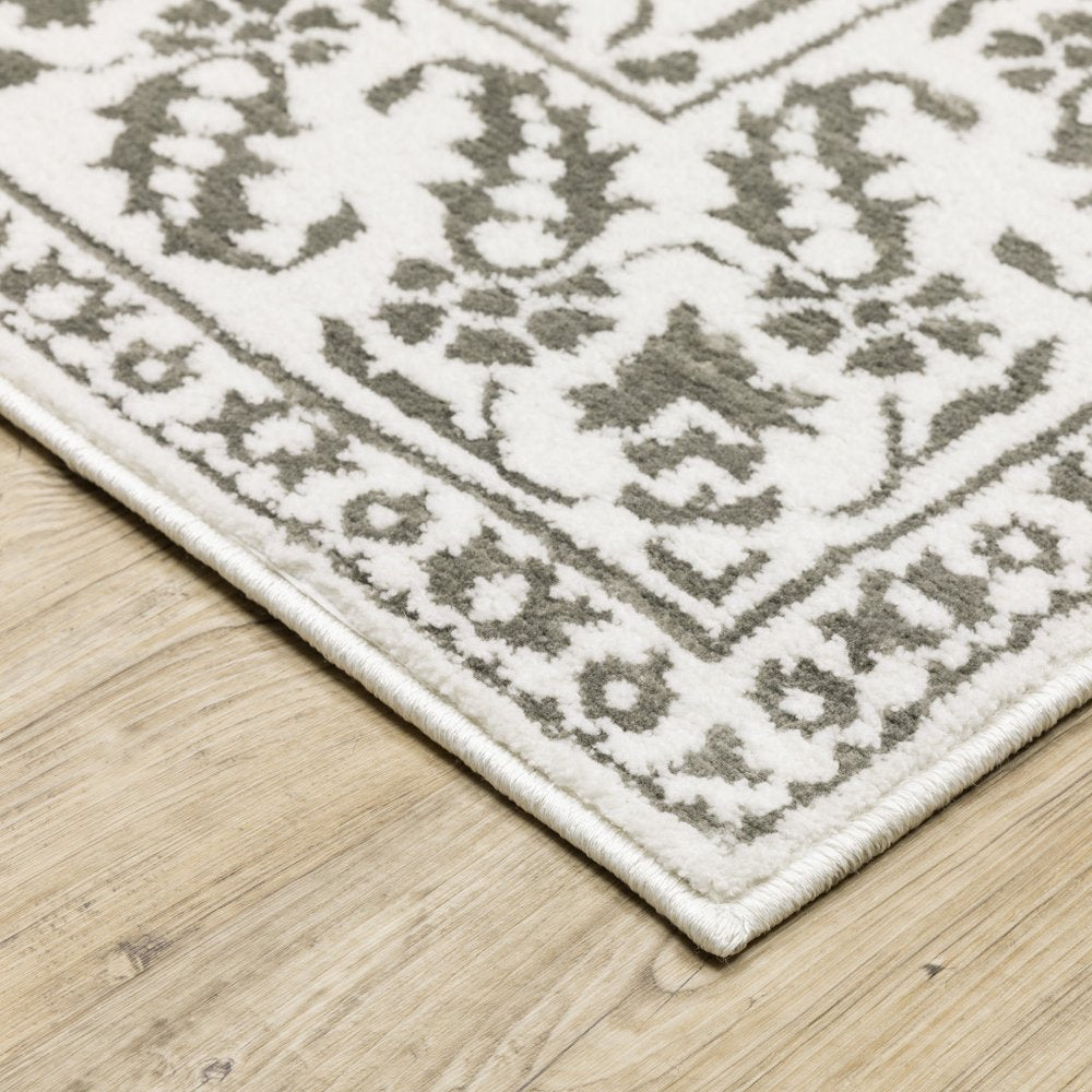 7' X 10' Gray And White Floral Distressed Area Rug